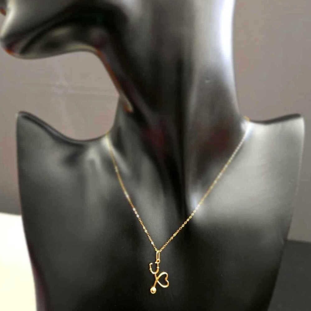 K18 gold pendant stethoscope heart design